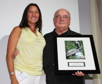 Owner of Second Wind, April Clark accepts the Award with federation's Vice President, Dick Bierly.