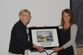 Midge Ogletree, left, accepting the award for the Town of Columbia from federation's coastal advocate, Ladd Bayliss.