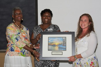 Lenora Jarvis-Mackey, left, and Angie Willis, center, accept the award from federation's education coordinator, Sara Hallas.