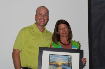 Hunter Freeman accepting the award from federation's Deputy Director, Lauren Kolodij.