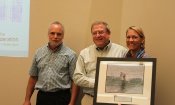 Allan Propst, center, accepting the award from federation's executive director Todd Miller and vice president Lauren Hermley.