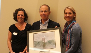 Bill Hettler accepting the award from federation's director of operations Rachael Carlyle, left, and federation's vice president Lauren Hermley.
