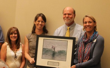 Craig Hardy, accepting the award from federation's coastal scientits, Dr. Lexia Weaver, left, and Erin Fleckenstein, and the federation's vice president Lauren Hermley, far right.