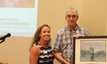 Ernest Boyce accepting the award from federation's education coordinator, Sara Hallas, left, and federation's vice president Lauren Hermley.