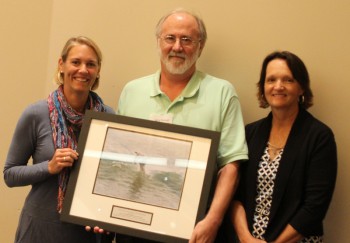 Jerry Parnell,center, accepting the award for the UNCW William Madison Randal Library from federation's coastal scientist, Tracy Skrabal, right, and federation's vice president Lauren Hermley.