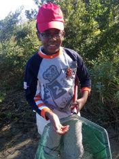 This student just caught a shrimp in the estuary.