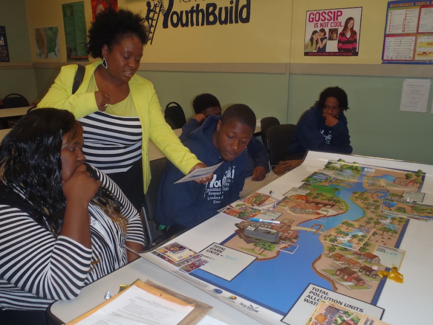 Angie Wills, YouthBuild program director, participates in a watershed activity with her students, during one of the classroom training sessions led by the federation