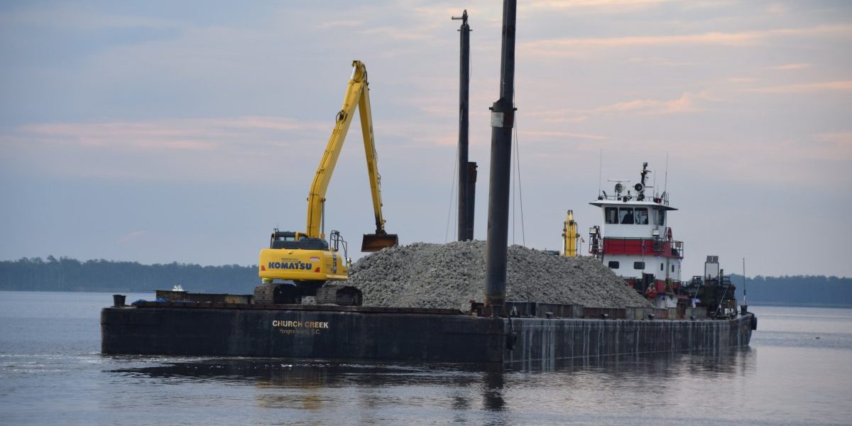 The barge departs the South River facility on May 3 on its way to the Swan Island Oyster Sanctuary Site in Pamlico Sound. Photo by Mark Hibbs. Swan Island