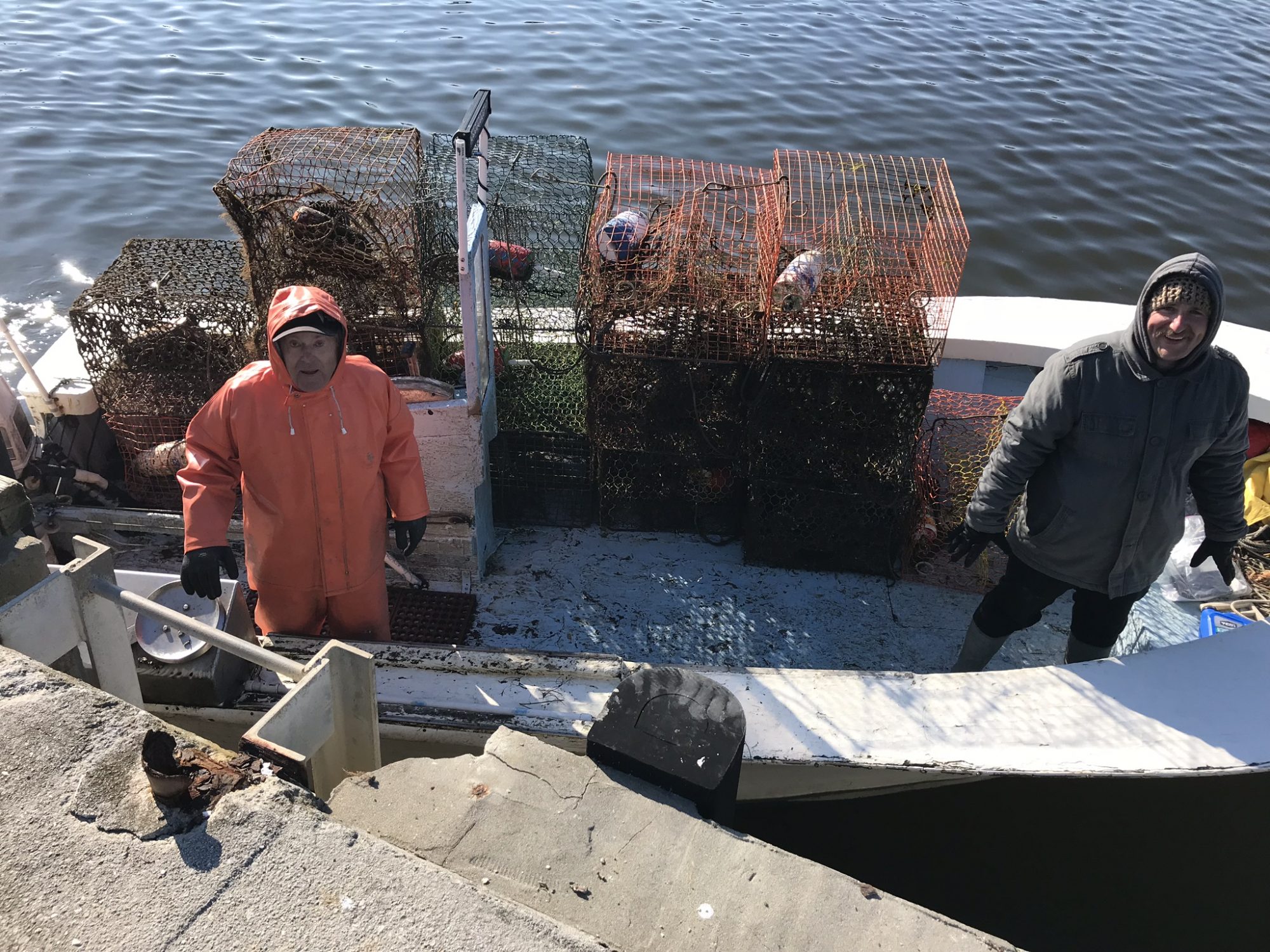 Fishermen collecting crab pots