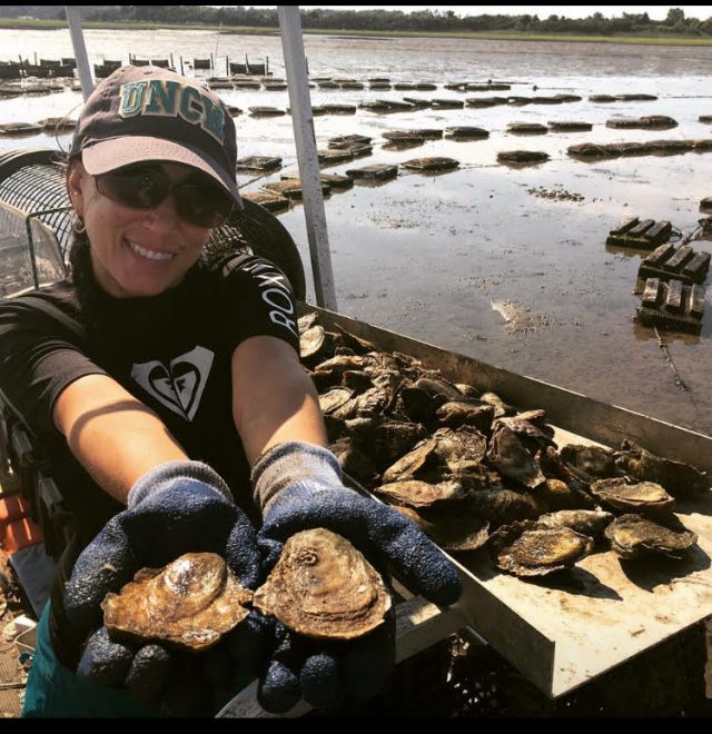 Oyster farmer working on oyster lease