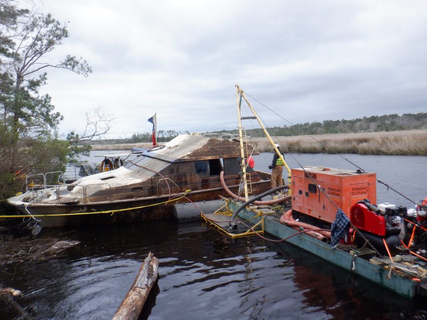 The federations removes a derelict vessel from Lockwood Folly River