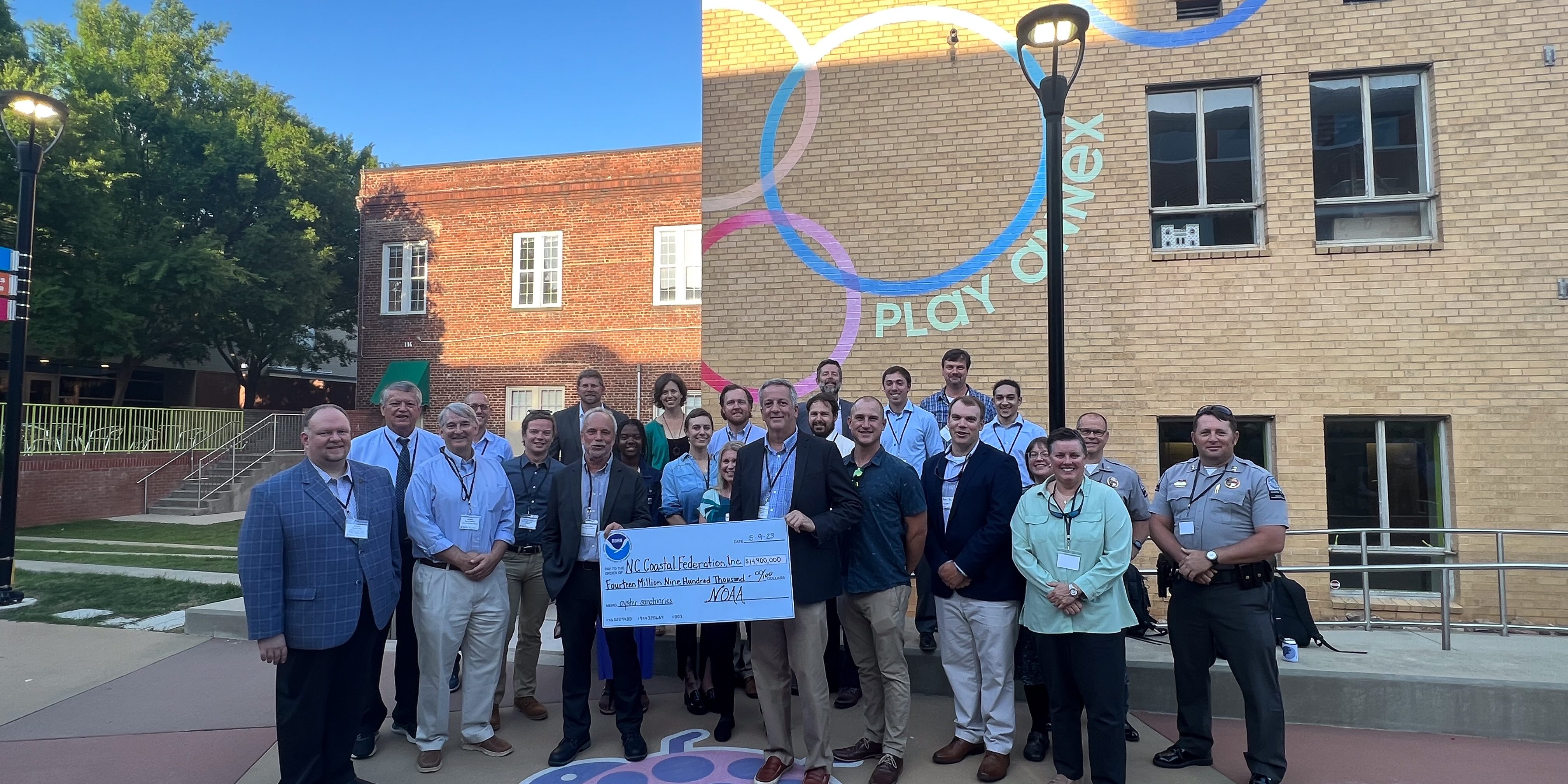 NOAA Officials present North Carolina Coastal Federation with a ceremonial check for grant funding