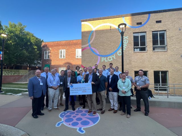 NOAA Officials present North Carolina Coastal Federation with a ceremonial check for grant funding