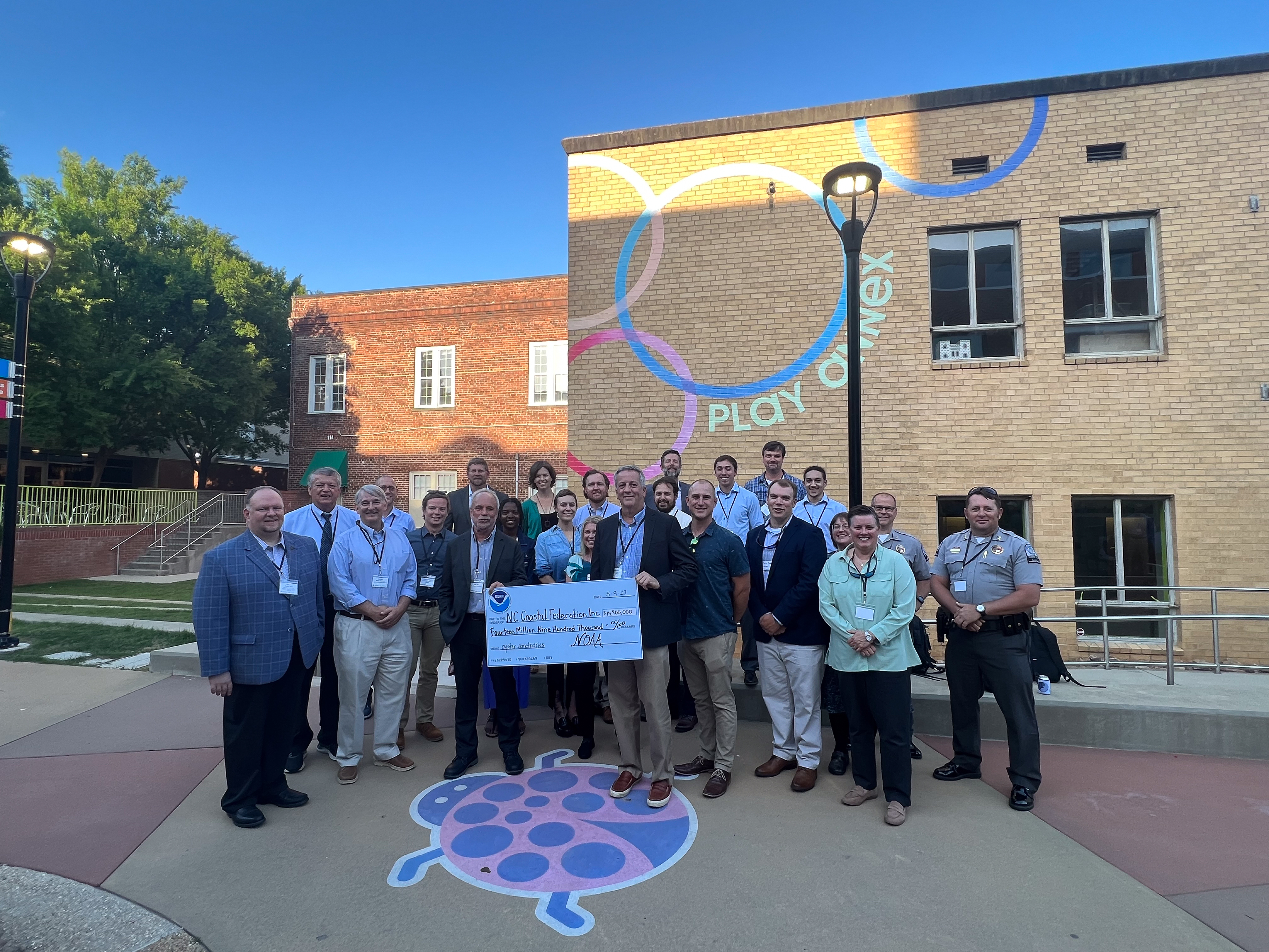 NOAA Officials present North Carolina Coastal Federation with a ceremonial check for grant funding