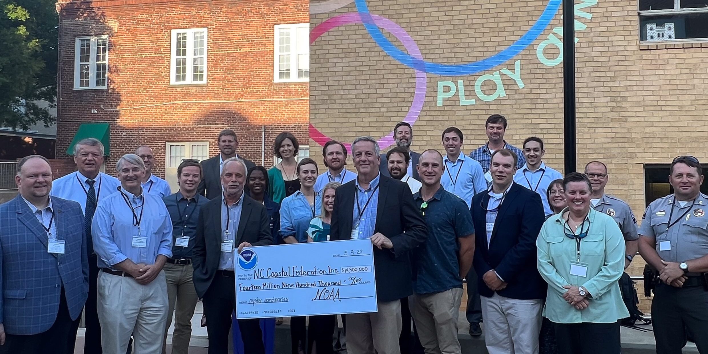 NOAA Officials present North Carolina Coastal Federation with a ceremonial check for grant funding