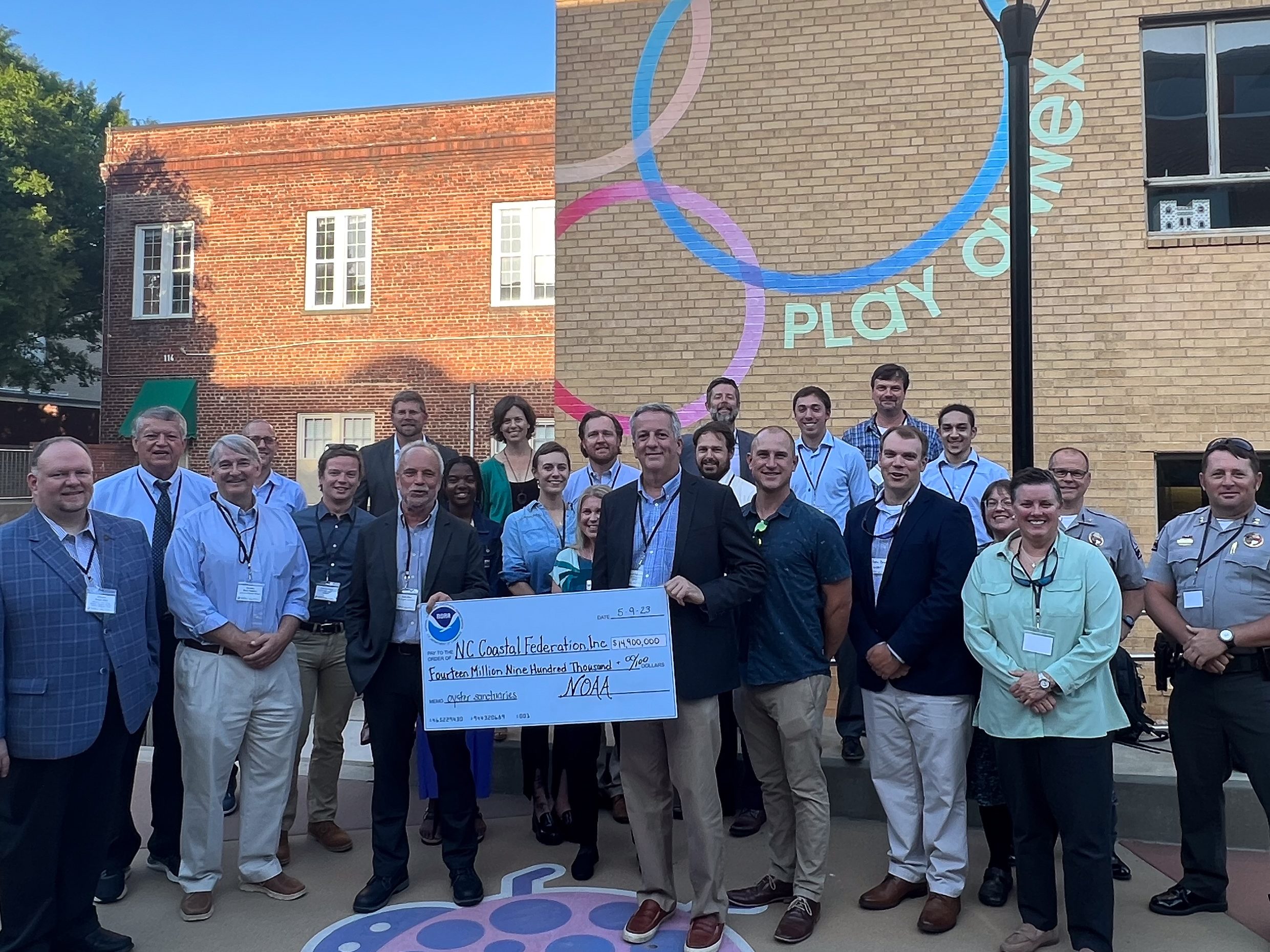 NOAA Officials present North Carolina Coastal Federation with a ceremonial check for grant funding