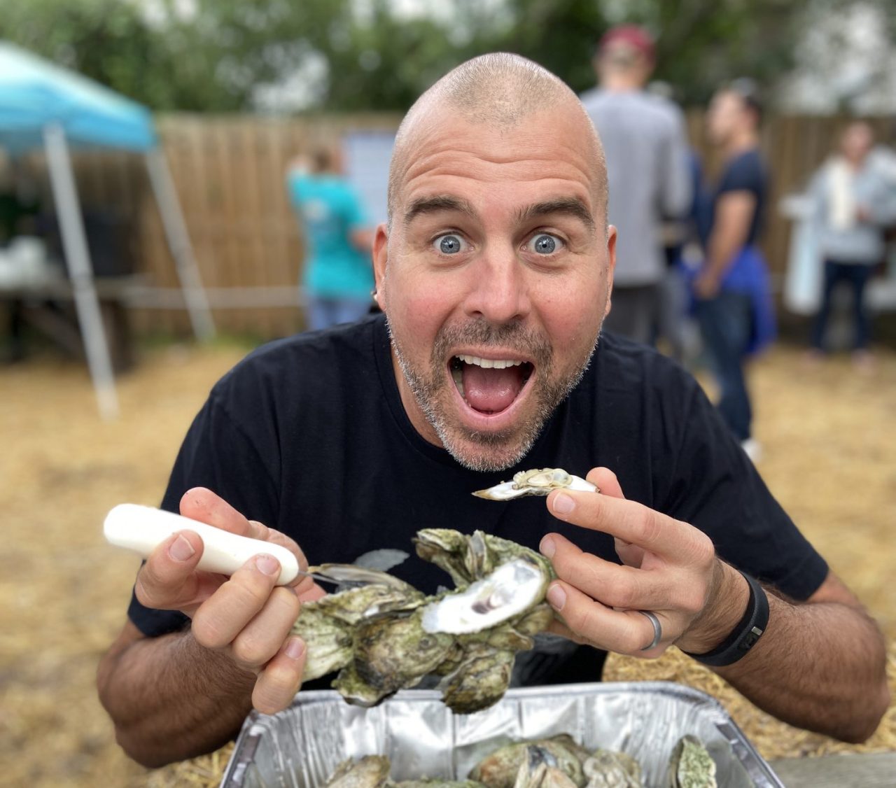 man eating oysters