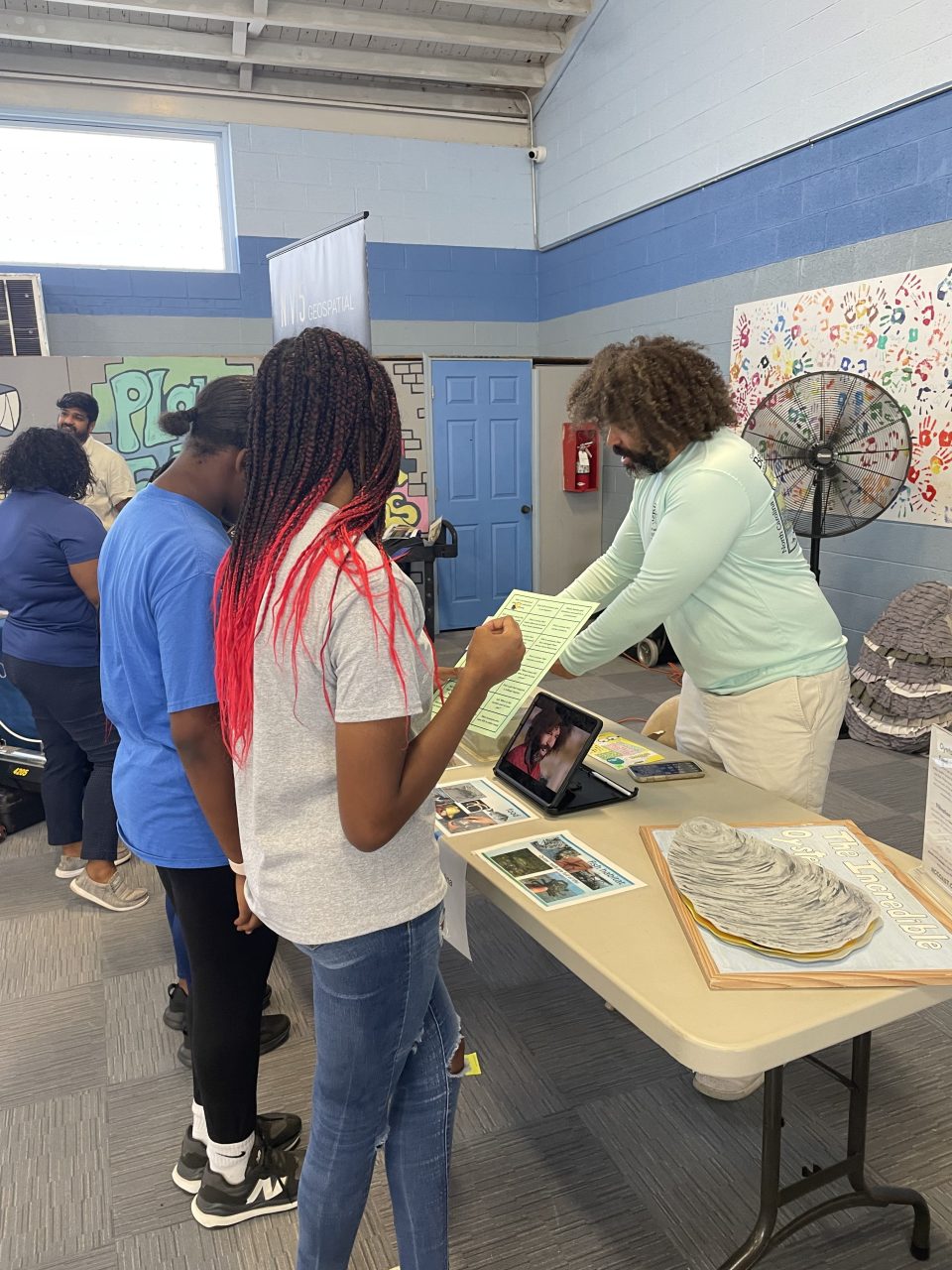 Students learn from Oyster Grower, Ryan Bethea at the Coastal STEM Career Fair